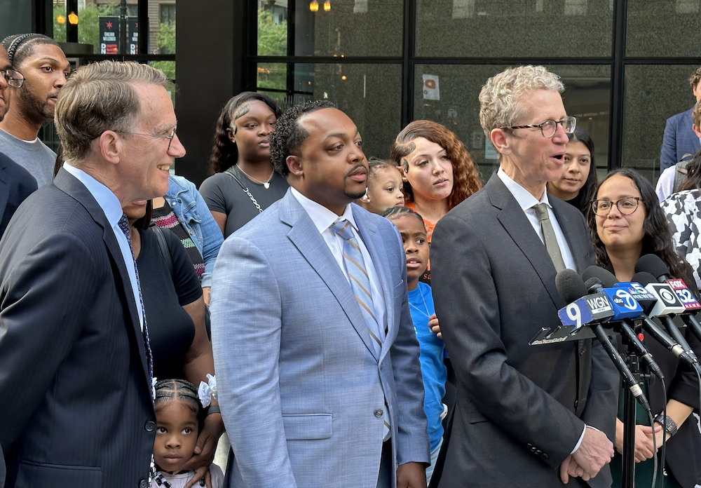 Locke Bowman, Marcel Brown, Jon Loevy, and Marcel's supporters stand at a press conference outside the courthouse in Chicago